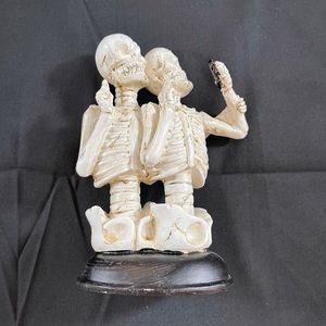 Halloween photo op. Skeletons taking a selfie.